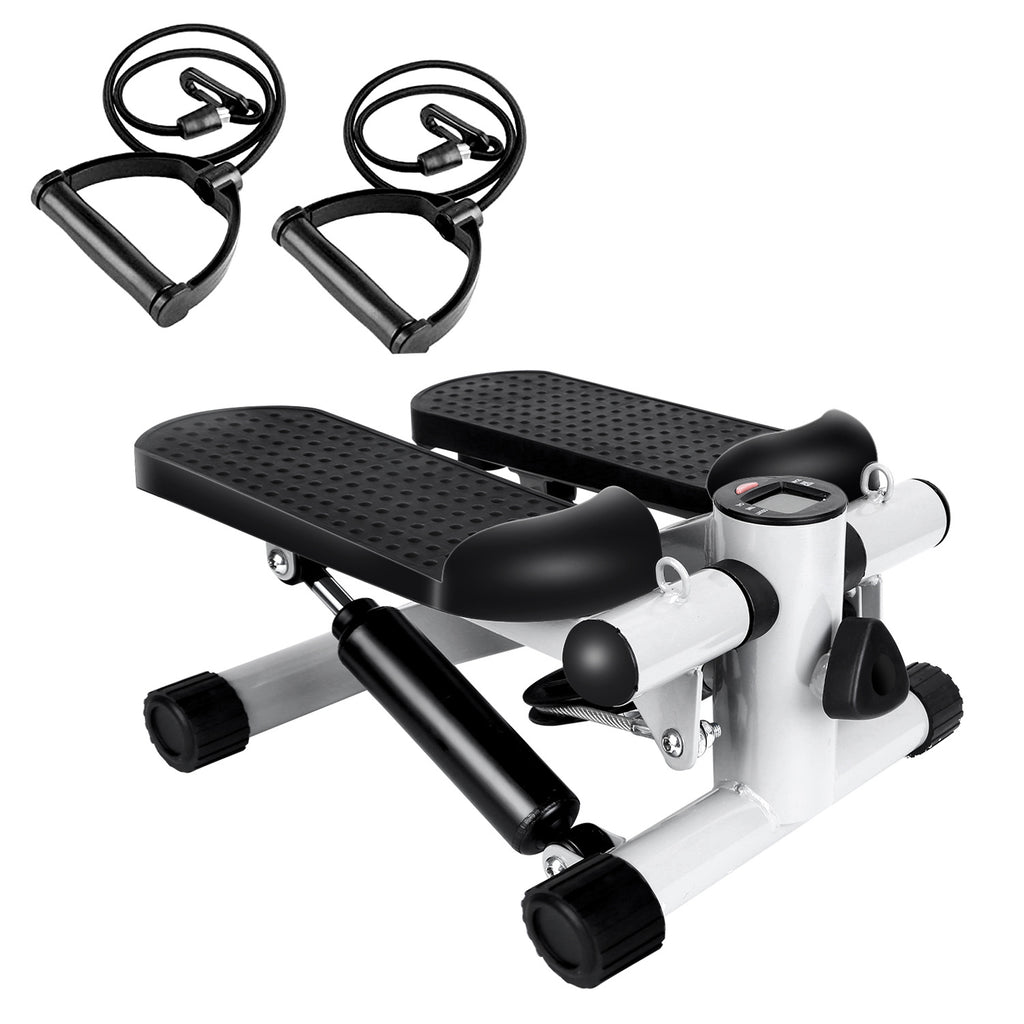 White and black exercise stepper with resistance bands on a white background